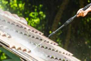 pressure washer cleaning roof tiles